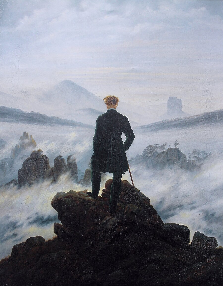 «El caminante sobre el mar de niebla» de Caspar David Friedrich: una figura de pie sobre una roca mirando un paisaje despejado